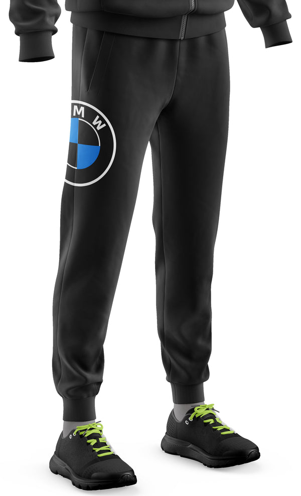 A pair of black BMW logo jogger pants with a visible brand emblem on the left thigh and a pair of sneakers attached to the pants.